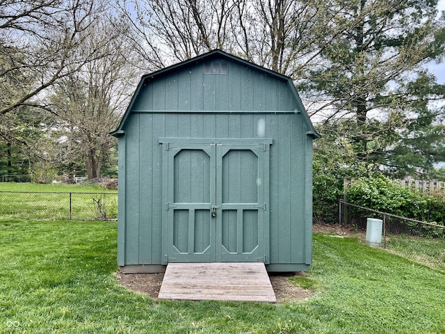 view of shed featuring fence