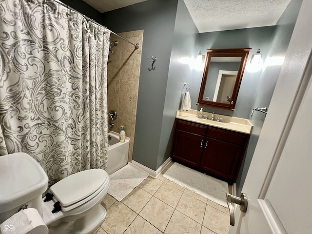 full bath featuring tile patterned flooring, vanity, shower / bath combination with curtain, toilet, and a textured ceiling