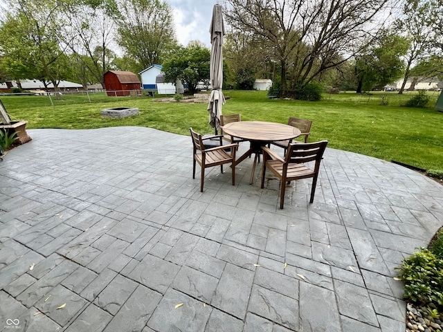view of patio featuring a fire pit and outdoor dining space