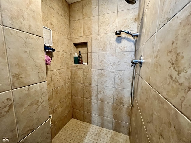 full bath featuring a tile shower