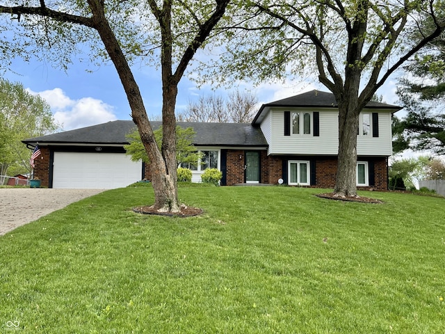 split level home with brick siding, driveway, a front lawn, and a garage