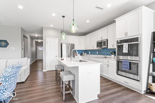 75 Hovden Dr, Cicero, IN 46034 - kitchen featuring a sink, appliances with stainless steel finishes, dark wood-style floors, and light countertops