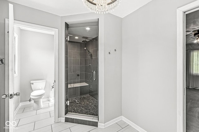 bathroom with a stall shower, baseboards, toilet, a notable chandelier, and recessed lighting