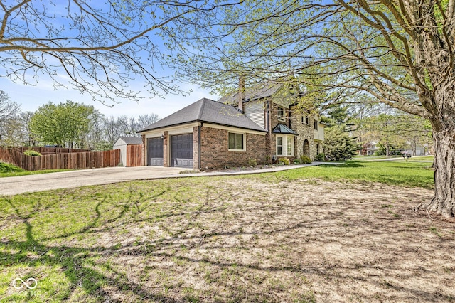 4152 S Creekside Dr, New Palestine, IN 46163 - view of home's exterior with driveway, brick siding, and a garage