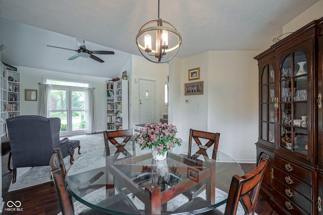 dining room featuring baseboards, dark wood finished floors, and ceiling fan with notable chandelier