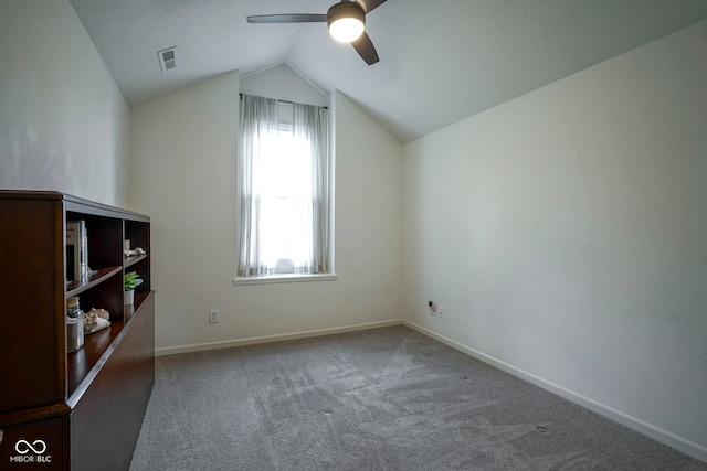 bonus room featuring ceiling fan, visible vents, vaulted ceiling, carpet floors, and baseboards