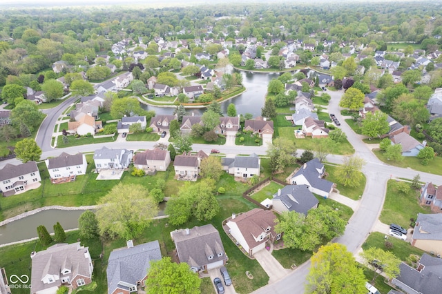 bird's eye view featuring a water view and a residential view
