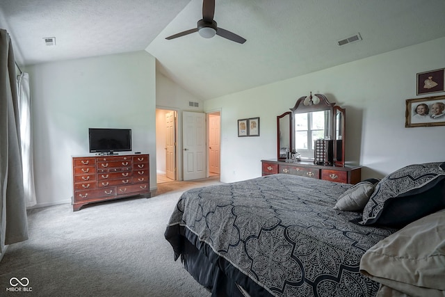 bedroom with carpet floors, lofted ceiling, and visible vents
