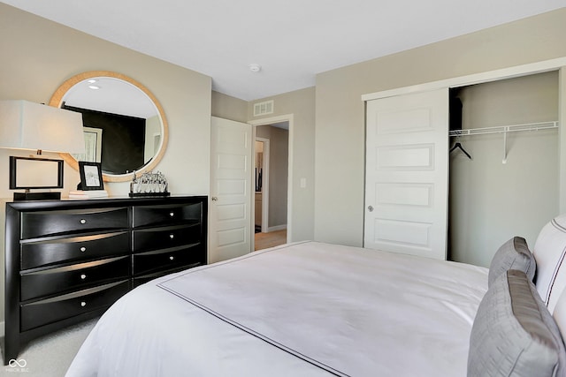 bedroom with visible vents and a closet