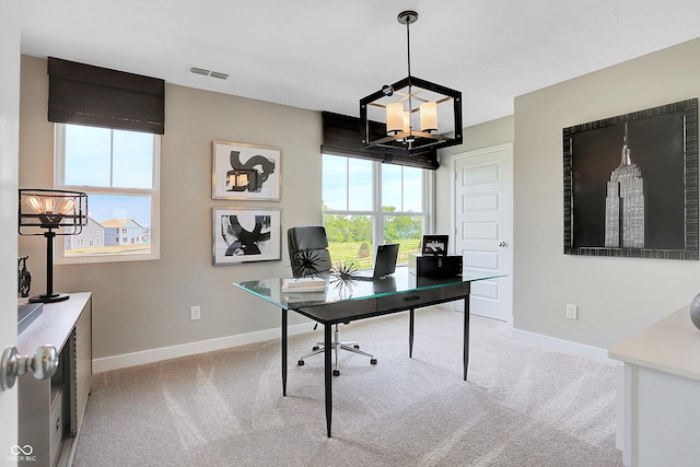 home office featuring an inviting chandelier, baseboards, visible vents, and light colored carpet