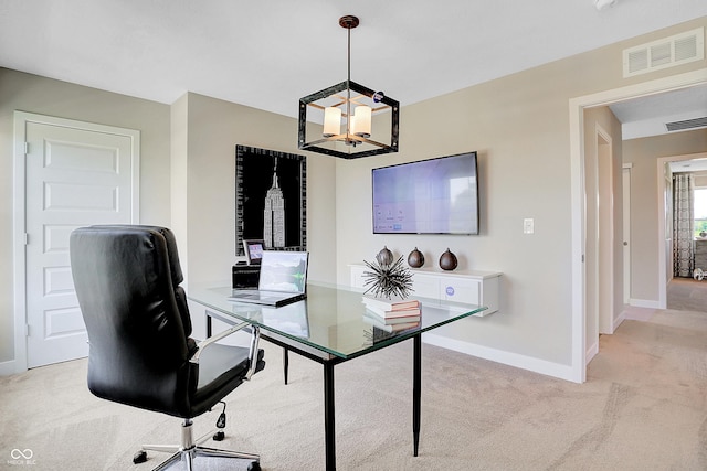 home office featuring light colored carpet, a notable chandelier, visible vents, and baseboards