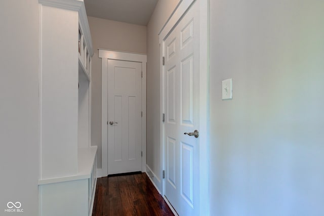 hall with dark wood-type flooring