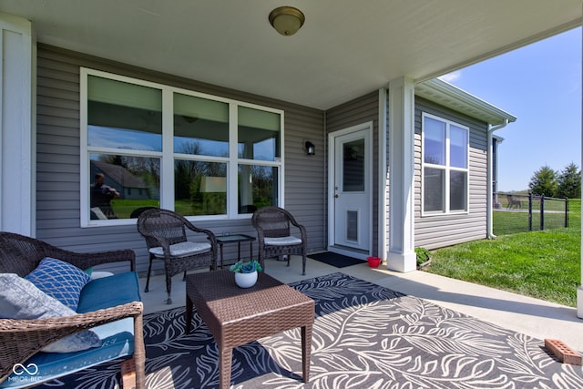 view of patio featuring fence