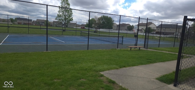 745 S Summerhaven Ct, New Palestine, IN 46163 - view of tennis court with fence, a lawn, and a residential view