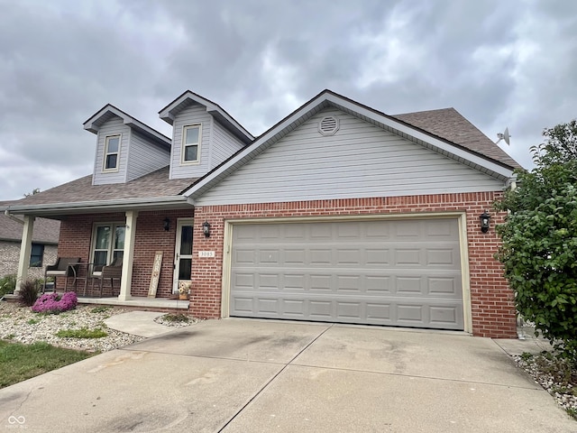 view of front of home with a porch, roof with shingles, brick siding, concrete driveway, and an attached garage