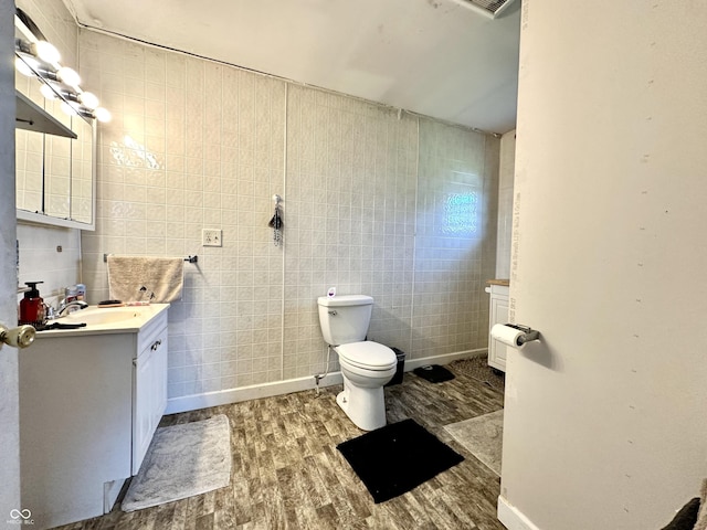 812 W Walnut Dr, Rockville, IN 47872 - half bath with vanity, toilet, wood finished floors, and tile walls