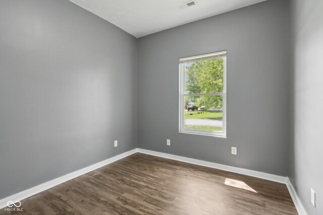 3098 Central, Arlington, IN 46104 - unfurnished room featuring baseboards, dark wood-style flooring, and visible vents