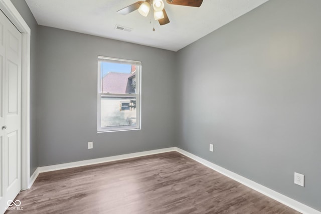 3098 Central, Arlington, IN 46104 - unfurnished bedroom featuring baseboards, a closet, wood finished floors, and visible vents