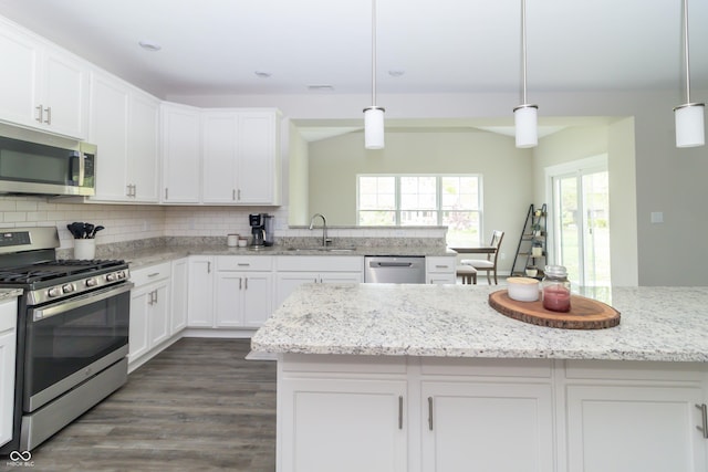 192 Lynnette Way, Cumberland, IN 46229 - kitchen with a sink, appliances with stainless steel finishes, decorative backsplash, and white cabinetry