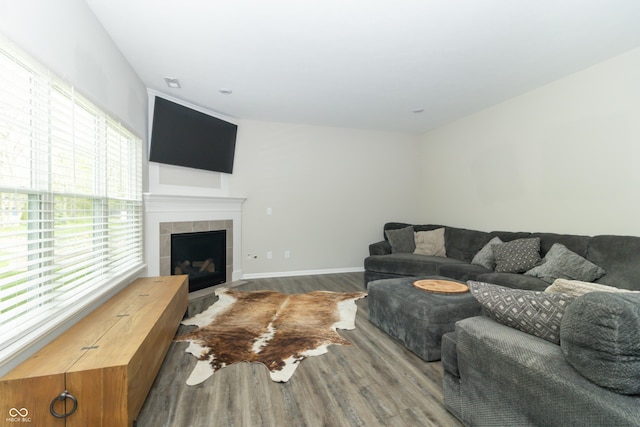 192 Lynnette Way, Cumberland, IN 46229 - living room with a tiled fireplace, baseboards, and wood finished floors