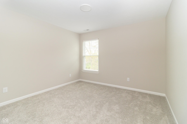 192 Lynnette Way, Cumberland, IN 46229 - empty room featuring baseboards and light carpet