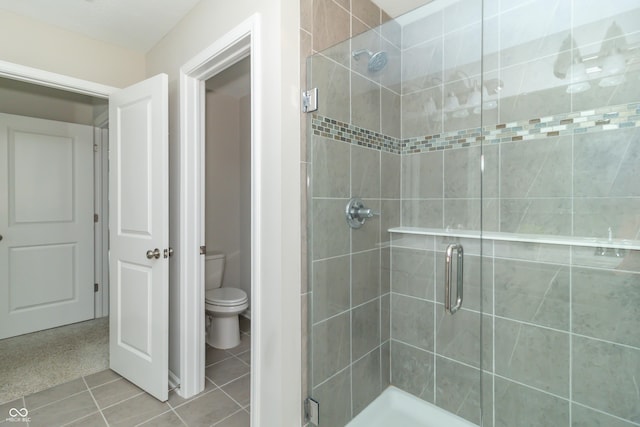 192 Lynnette Way, Cumberland, IN 46229 - bathroom with tile patterned flooring, toilet, and a shower stall