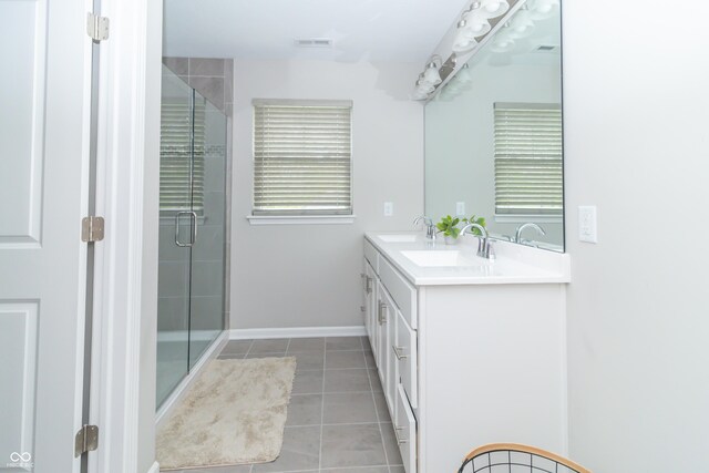 192 Lynnette Way, Cumberland, IN 46229 - full bathroom with tile patterned floors, visible vents, a shower stall, and a sink