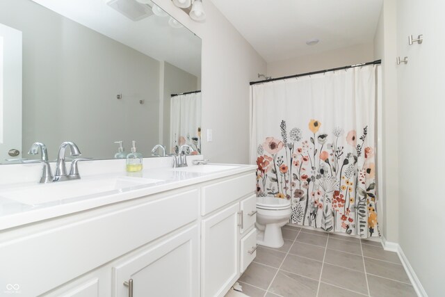 192 Lynnette Way, Cumberland, IN 46229 - full bath featuring double vanity, a sink, tile patterned floors, and toilet