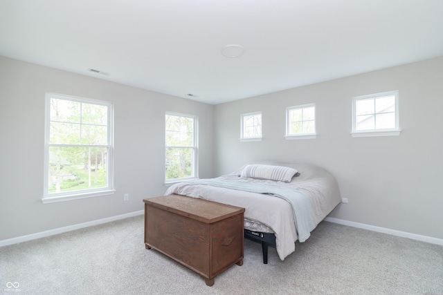 192 Lynnette Way, Cumberland, IN 46229 - bedroom with baseboards, visible vents, and light carpet