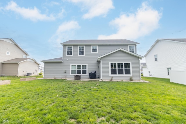 192 Lynnette Way, Cumberland, IN 46229 - rear view of house featuring a yard, a patio area, and central air condition unit