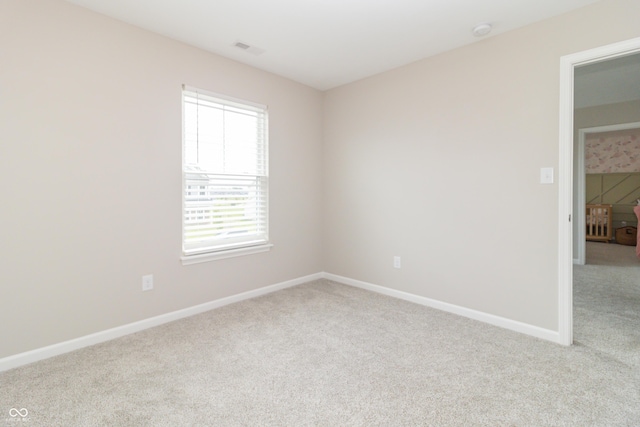 192 Lynnette Way, Cumberland, IN 46229 - spare room featuring baseboards, visible vents, and light carpet