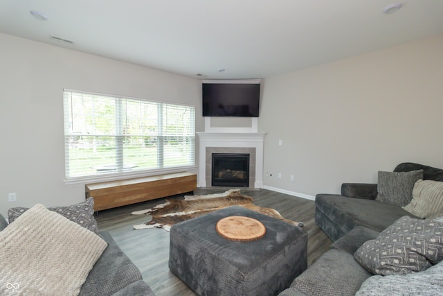 192 Lynnette Way, Cumberland, IN 46229 - living room with baseboards, visible vents, a tiled fireplace, and wood finished floors