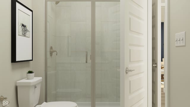 full bathroom featuring toilet and a shower stall