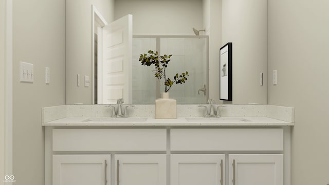 bathroom featuring double vanity, a sink, and a shower with door