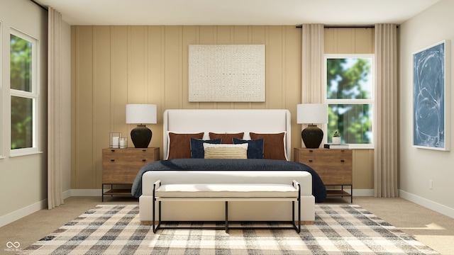 carpeted bedroom featuring baseboards