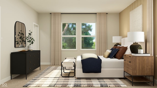 bedroom with baseboards and light carpet