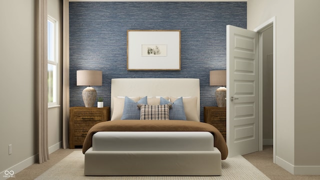 bedroom with baseboards and carpet