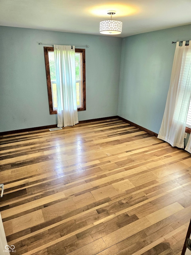 1647 State Ferry Rd, Solsberry, IN 47459 - empty room with baseboards and hardwood / wood-style floors