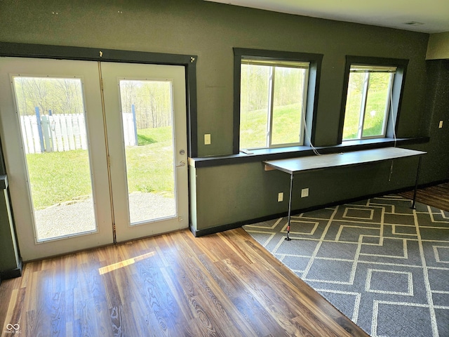 1647 State Ferry Rd, Solsberry, IN 47459 - doorway featuring a healthy amount of sunlight and wood finished floors