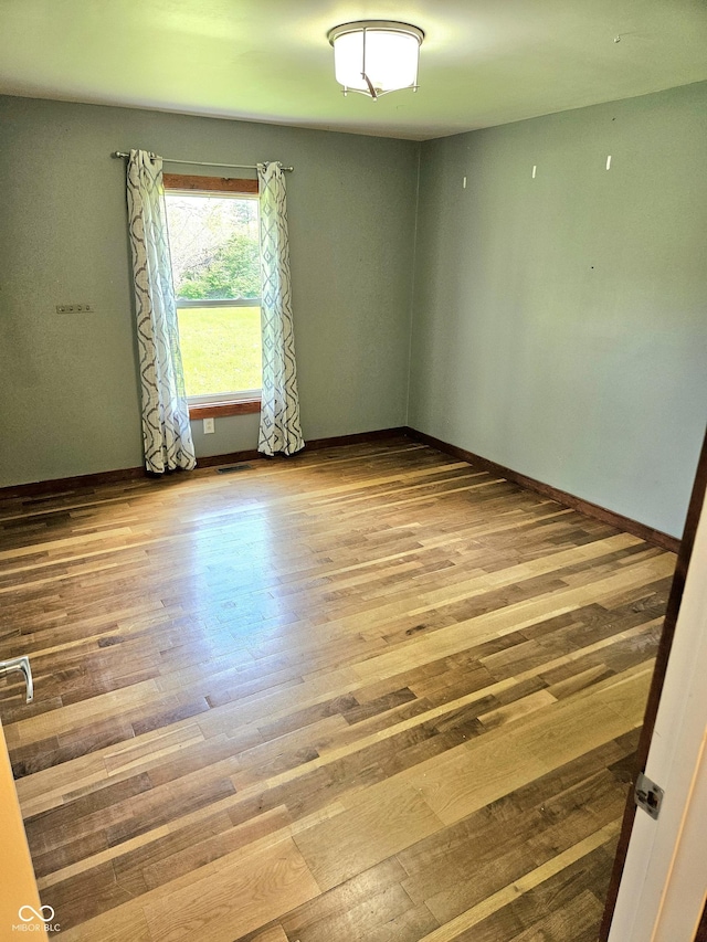 1647 State Ferry Rd, Solsberry, IN 47459 - unfurnished room featuring baseboards and wood finished floors