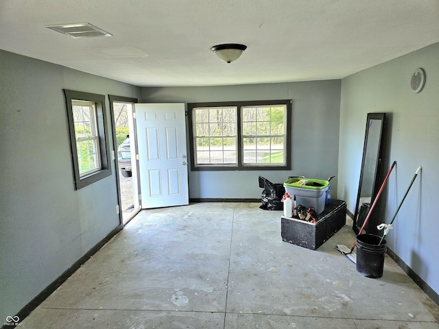 1647 State Ferry Rd, Solsberry, IN 47459 - entryway featuring baseboards, unfinished concrete flooring, and visible vents