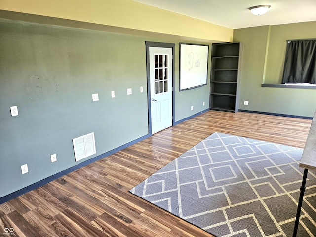 1647 State Ferry Rd, Solsberry, IN 47459 - foyer entrance with visible vents, baseboards, and wood finished floors