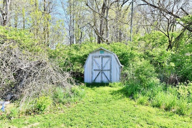 view of shed featuring a wooded view