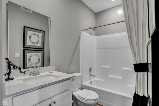 bathroom featuring shower / bath combo with shower curtain, toilet, visible vents, and vanity