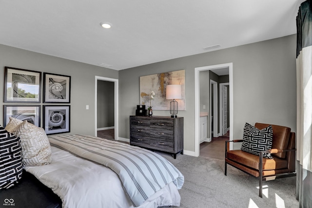 bedroom with baseboards, carpet flooring, and visible vents