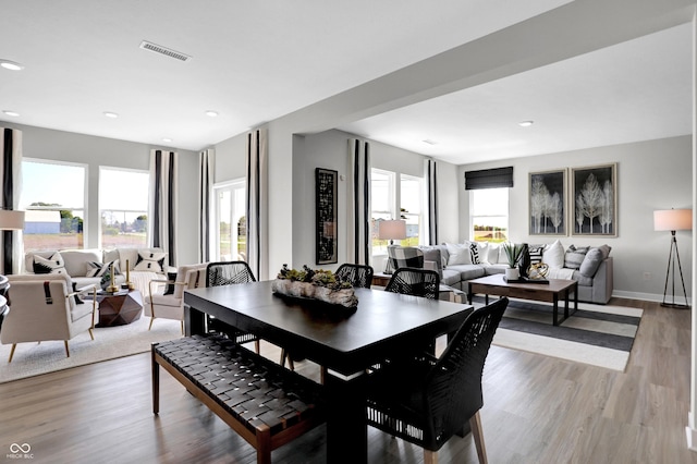 dining space featuring recessed lighting, baseboards, light wood-type flooring, and visible vents