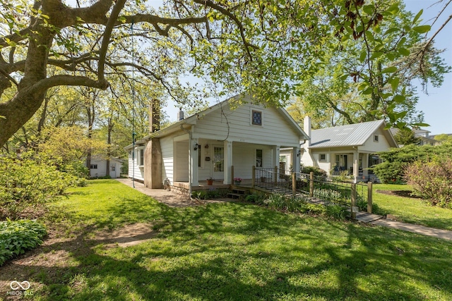 4710 Hinesley Ave, Indianapolis, IN 46208 - view of front of home featuring covered porch and a front yard