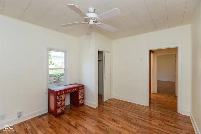 4710 Hinesley Ave, Indianapolis, IN 46208 - unfurnished bedroom featuring ceiling fan, light wood finished floors, and visible vents