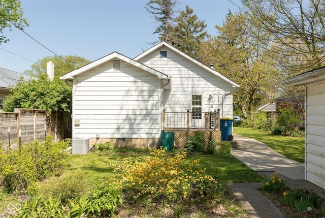 4710 Hinesley Ave, Indianapolis, IN 46208 - view of home's exterior featuring central AC, a lawn, fence, and crawl space