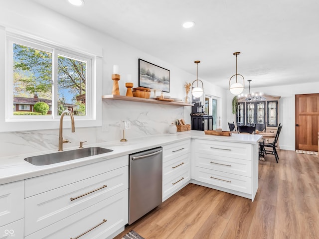 kitchen featuring a sink, recessed lighting, stainless steel dishwasher, and open shelves